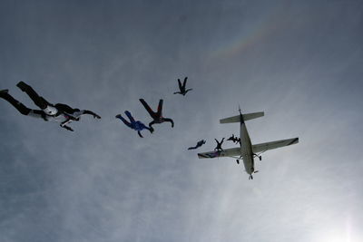 Low angle view of airplane flying in sky