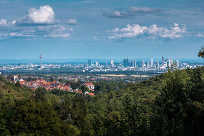 High angle view of trees and buildings against sky