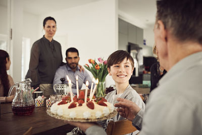 Portrait of friends on table