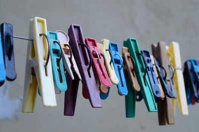 Close-up of multi colored clothespins on table