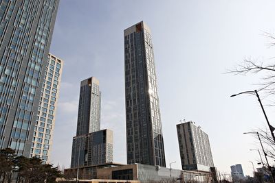 Low angle view of buildings against sky in city