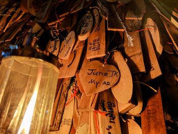 Close-up of text hanging on wood at temple