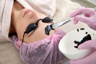 High angle view of doctor examining patient in hospital