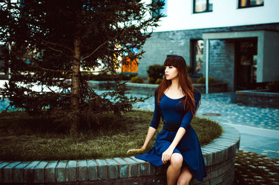 Young woman sitting outdoors