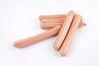 High angle view of bread on plate against white background