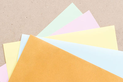 High angle view of colorful papers on table