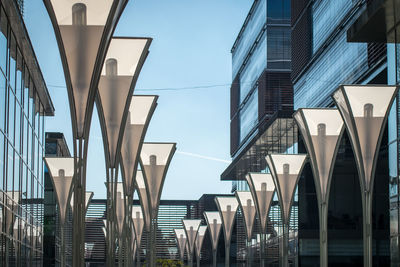 Low angle view of modern buildings against clear sky