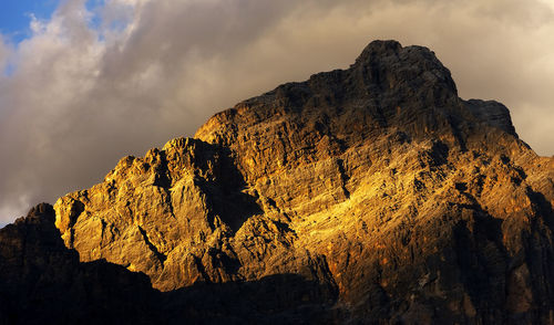 Rocky landscape against clouds