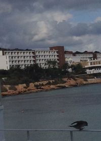 View of buildings against cloudy sky