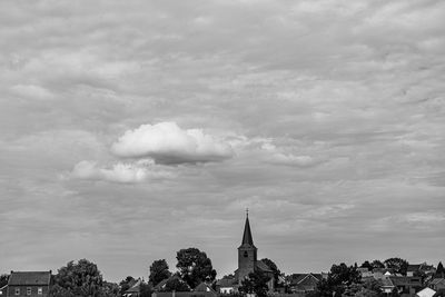 View of buildings against cloudy sky