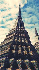 Low angle view of temple against cloudy sky