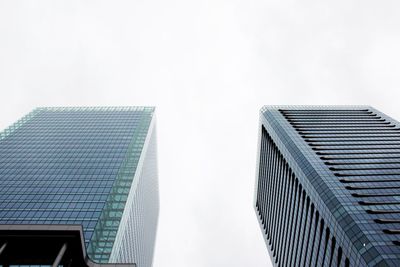 Low angle view of skyscrapers against clear sky