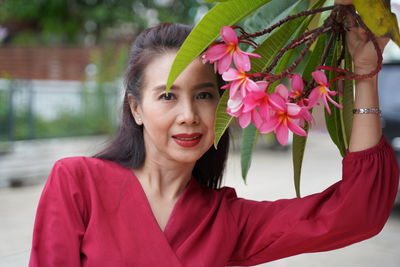 Portrait of woman admire flowers