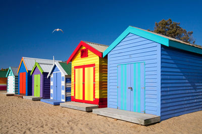 Beach huts against blue sky