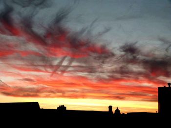 Silhouette of built structure against dramatic sky