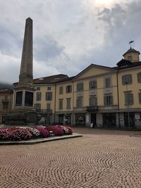 Low angle view of building against cloudy sky