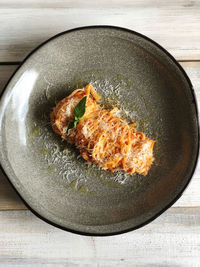 High angle view of fish in plate on table
