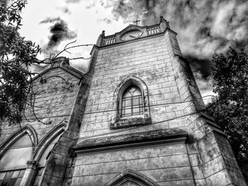 Low angle view of old building against sky