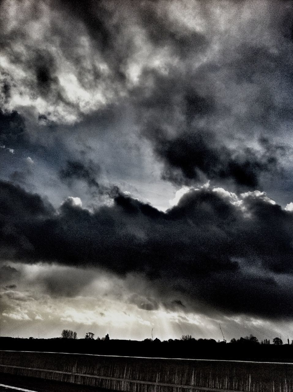 sky, cloud - sky, cloudy, weather, overcast, cloud, built structure, storm cloud, architecture, building exterior, cloudscape, nature, scenics, tranquility, low angle view, dusk, beauty in nature, dramatic sky, tranquil scene, outdoors