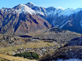 Scenic view of snowcapped mountains against sky