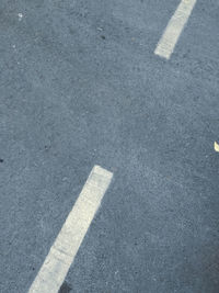 High angle view of arrow sign on road