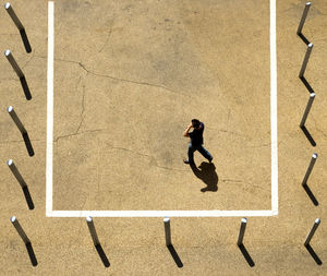 High angle view of man walking on land