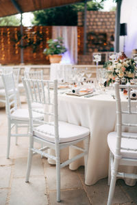 Empty chairs and tables in restaurant