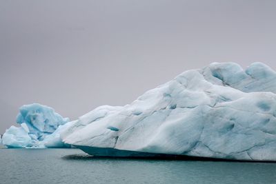 Scenic view of frozen sea against sky