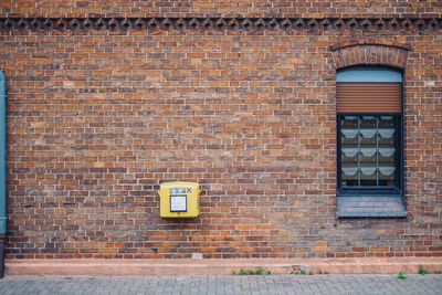 Full frame shot of brick wall with post box 