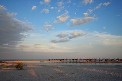 Scenic view of beach against sky during sunset