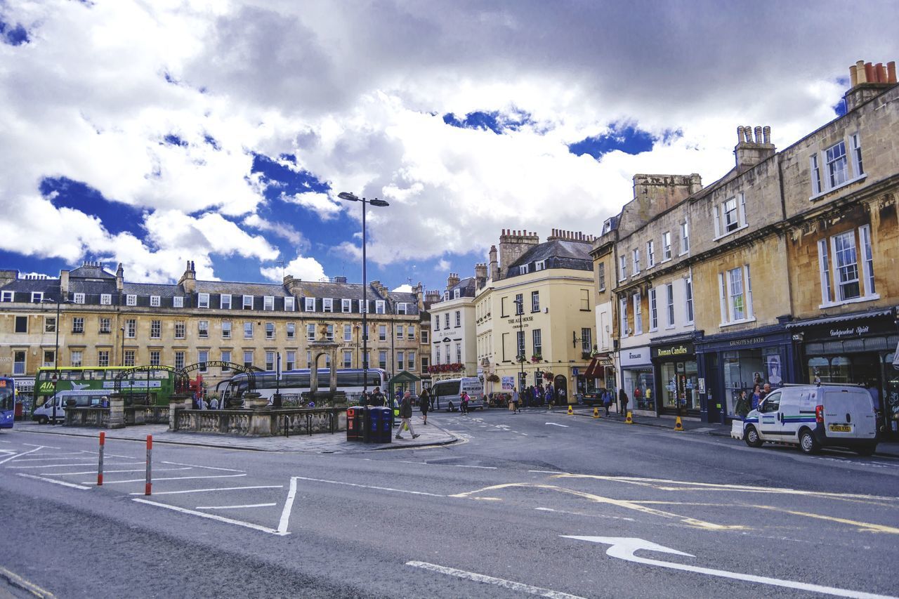 ROAD BY BUILDINGS AGAINST SKY