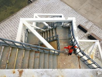 High angle view of man working on staircase