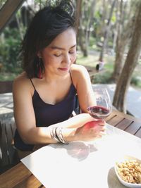 Young woman sitting on table