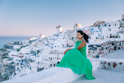 Full length portrait of woman on land against sky