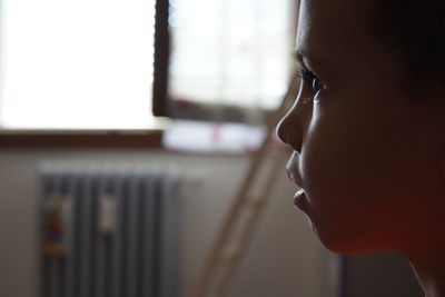 Close-up portrait of a woman at home
