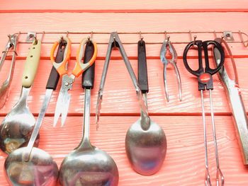 Row of clothes hanging on wall