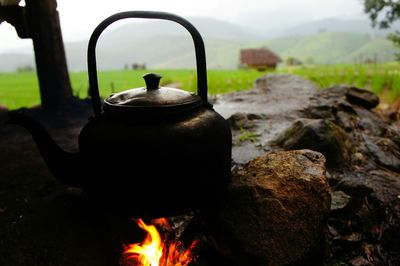 Close-up of kettle on fire