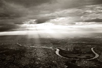 Aerial view of landscape against cloudy sky