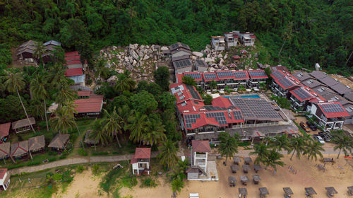 Aerial view of beach scenery with resorts in tioman island, pahang, malaysia.