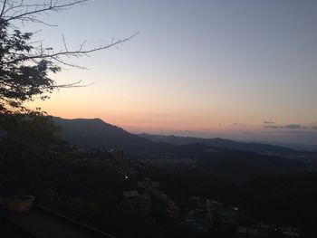 Scenic view of mountains against sky at sunset