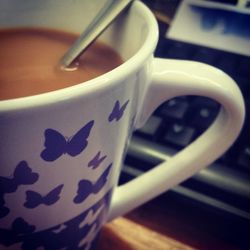 Close-up of coffee cup on table