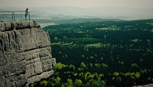 Woman standing on observation point at stolowe mountains national park