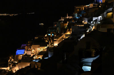 High angle view of illuminated buildings in city at night