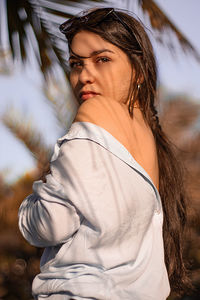 Portrait of young woman standing outdoors