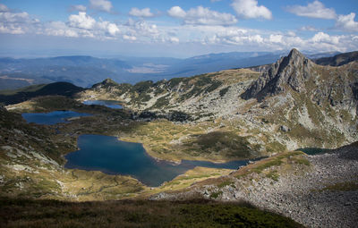 Scenic view of landscape and mountains against sky