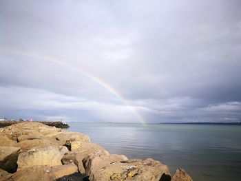 Scenic view of rainbow over sea