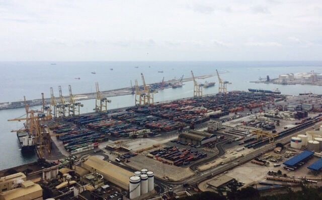 HIGH ANGLE VIEW OF COMMERCIAL DOCK AGAINST SKY