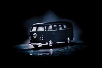 Close-up of toy car against black background