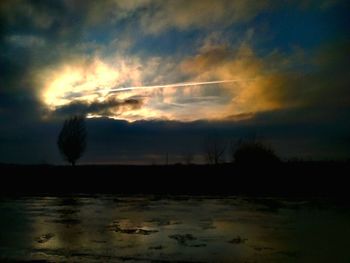 Scenic view of silhouette trees against sky during sunset