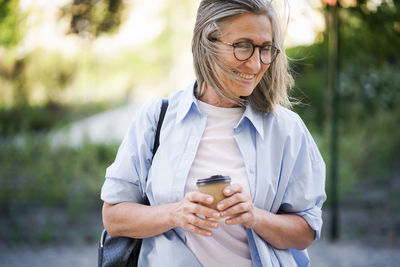 Young woman using mobile phone